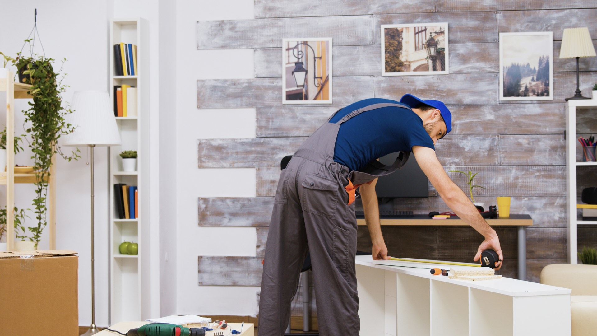 Ontario Handymen technician assembling furniture in a new home after moving in, Toronto